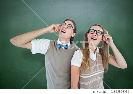 Composite image of geeky hipsters looking confused Composite image of geeky hipsters looking confused 18199345