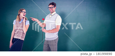 Composite image of geeky hipster holding rose and pointing his g Composite image of geeky hipster holding rose and pointing his g 18199890