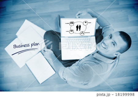 Business plan against young creative businessman working on lapt Business plan against young creative businessman working on lapt 18199998