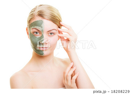 Woman in clay mud mask on face isolated on white. 18208229