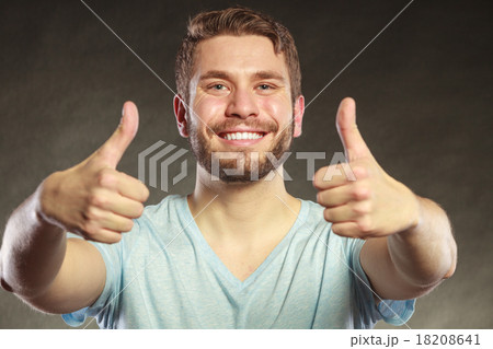 Handsome man guy giving thumb up gesture. 18208641