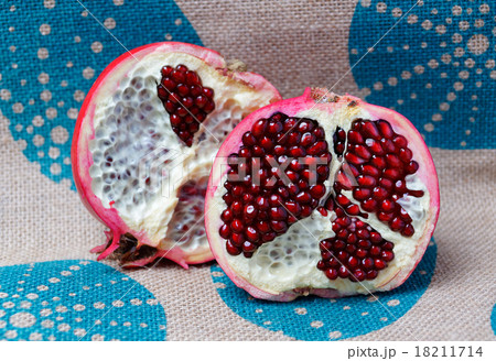 Half a large red pomegranate Half a large red pomegranate 18211714