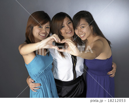 three asian girl friends posing in black 18212053