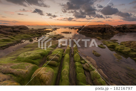 leading line rock formation under bright sunset leading line rock formation under bright sunset 18216797