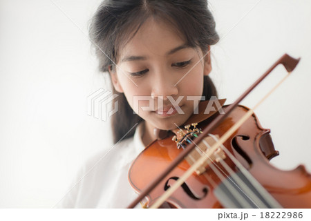close up Asian teenager playing violin, 18222986