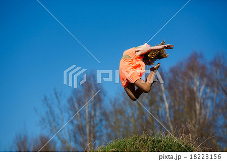 Young gymnast doing exercises 18223156