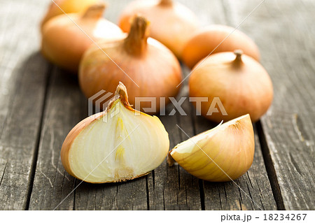 halved fresh onion on wooden table 18234267