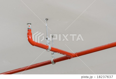 Fire sprinkler and red pipe on ceiling Fire sprinkler and red pipe on ceiling 18237637