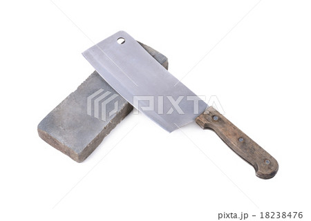Sharpening or honing a knife on a grindstone Sharpening or honing a knife on a grindstone 18238476
