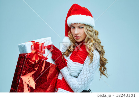 Beautiful young woman in Santa Claus clothes Beautiful young woman in Santa Claus clothes 18243301