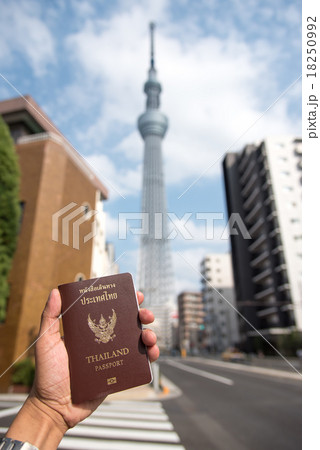 left hand holding Thai passport left hand holding Thai passport 18250992