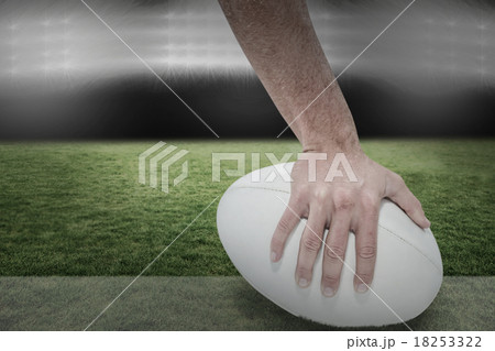 Composite image of close-up of sports player holding ball Composite image of close-up of sports player holding ball 18253322