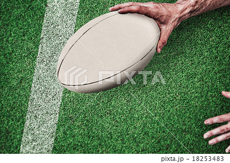 Composite image of cropped image of a man holding rugby ball 18253483