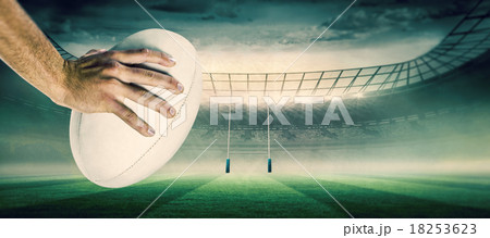 Composite image of cropped image of sports player holding ball 18253623