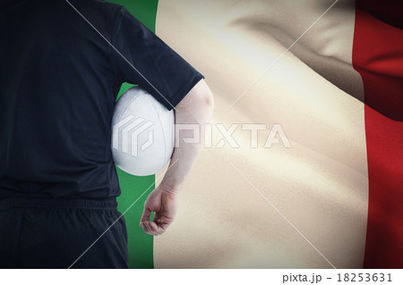 Composite image of rugby player holding a rugby ball 18253631