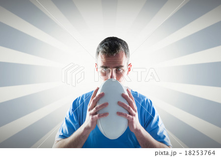 Composite image of rugby player throwing a rugby ball Composite image of rugby player throwing a rugby ball 18253764