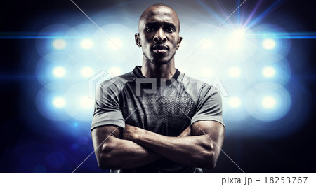 Composite image of portrait of confident rugby player with arms Composite image of portrait of confident rugby player with arms 18253767
