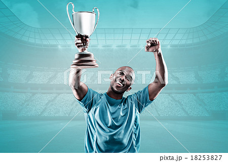 Composite image of happy sportsman looking up and cheering while Composite image of happy sportsman looking up and cheering while 18253827