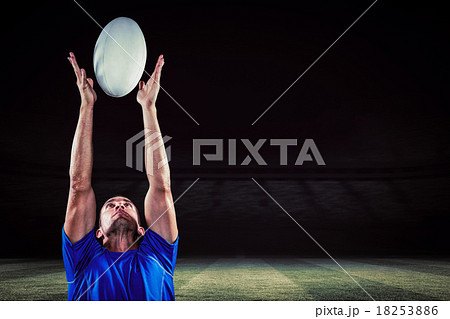 Composite image of rugby player catching ball 18253886