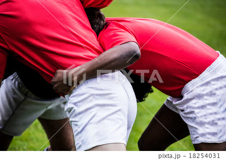 Rugby players doing a scrum 18254031