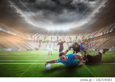 Composite image of rugby player doing a drop kick 18254083