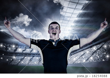 Composite image of a rugby player gesturing victory Composite image of a rugby player gesturing victory 18254088