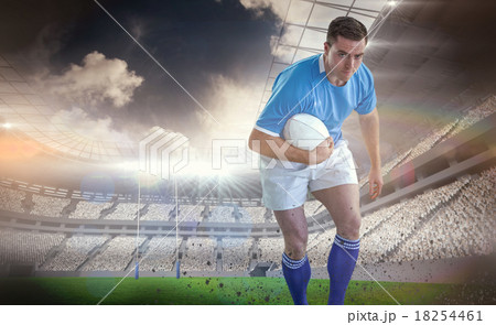 Composite image of rugby player doing a side pass Composite image of rugby player doing a side pass 18254461