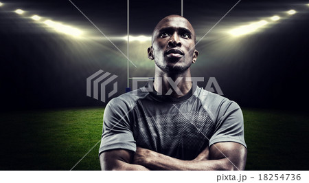 Composite image of thoughtful rugby player with arms crossed Composite image of thoughtful rugby player with arms crossed 18254736