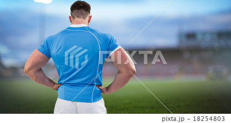 Composite image of rugby player with hands on hips 18254803
