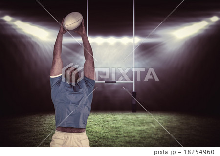 Composite image of rugby player catching the ball Composite image of rugby player catching the ball 18254960
