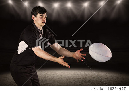 Composite image of rugby player throwing a rugby ball 18254997