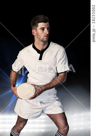 Composite image of rugby player defending with the ball Composite image of rugby player defending with the ball 18255002