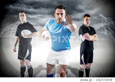 Composite image of tough rugby players Composite image of tough rugby players 18255009