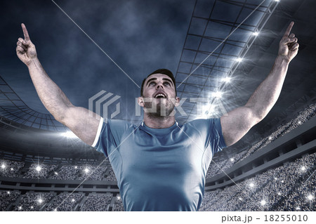 Composite image of rugby player cheering and pointing Composite image of rugby player cheering and pointing 18255010