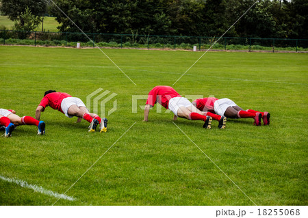 Rugby players doing push ups 18255068