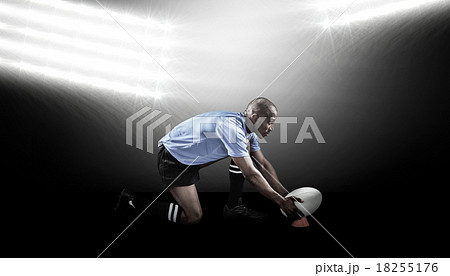 Composite image of rugby player keeping ball on kicking tee 18255176