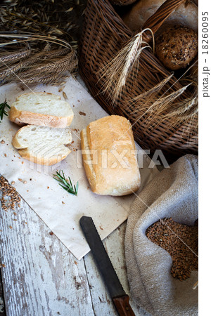 fresh bread and wheat on the wooden table fresh bread and wheat on the wooden table 18260095