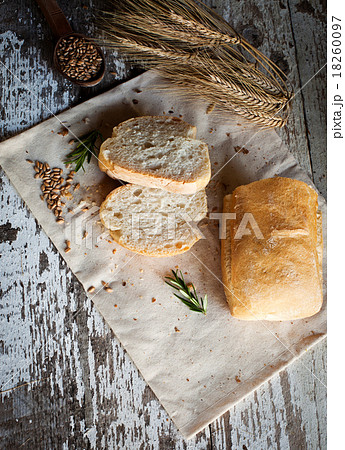 fresh bread and wheat on the wooden table fresh bread and wheat on the wooden table 18260097
