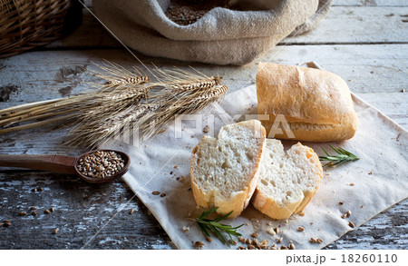 fresh bread and wheat on the wooden table fresh bread and wheat on the wooden table 18260110