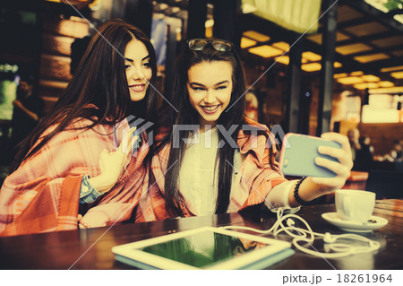 two close friends make selfie in the cafe two close friends make selfie in the cafe 18261964