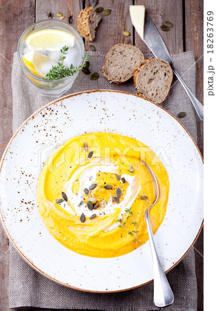 Pumpkin soup with cream, seeds and thyme  18263769