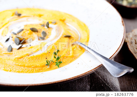 Pumpkin soup with cream, seeds and thyme  18263776