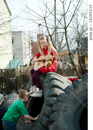 children playing in junkyard tires children playing in junkyard tires 18265215