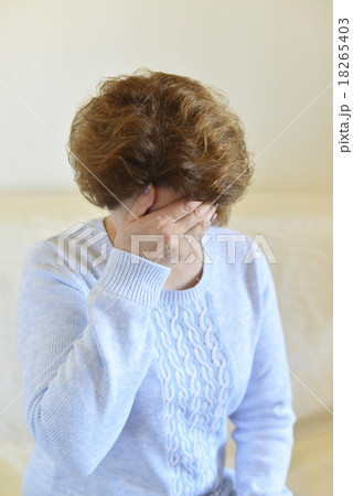 frustrated woman covering her face with hands 18265403