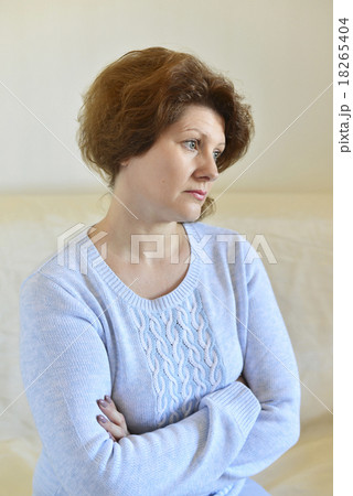 Sad woman looking away at home in  living room 18265404