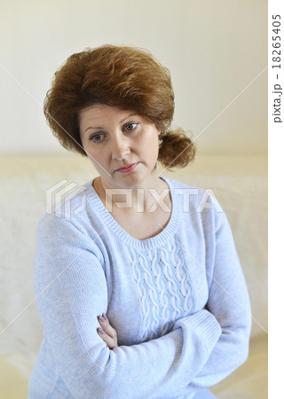 Sad woman looking away at home in  living room 18265405