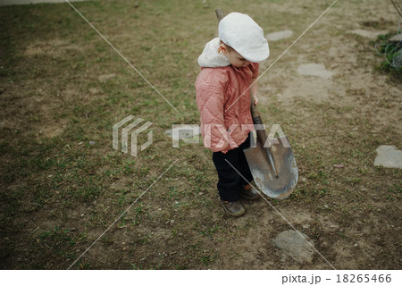 little boy digging a hole little boy digging a hole 18265466