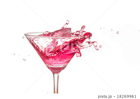 Red coctail splash on white background close up 18269961
