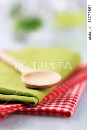 Wooden spoon and table linens Wooden spoon and table linens 18275860