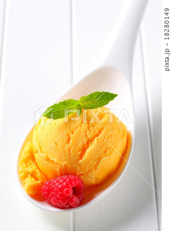 Yellow ice cream on spoon 18280149
